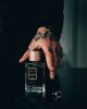Holding the Brouq perfume bottle